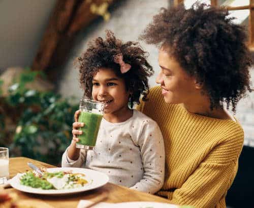 kids drinking green juice